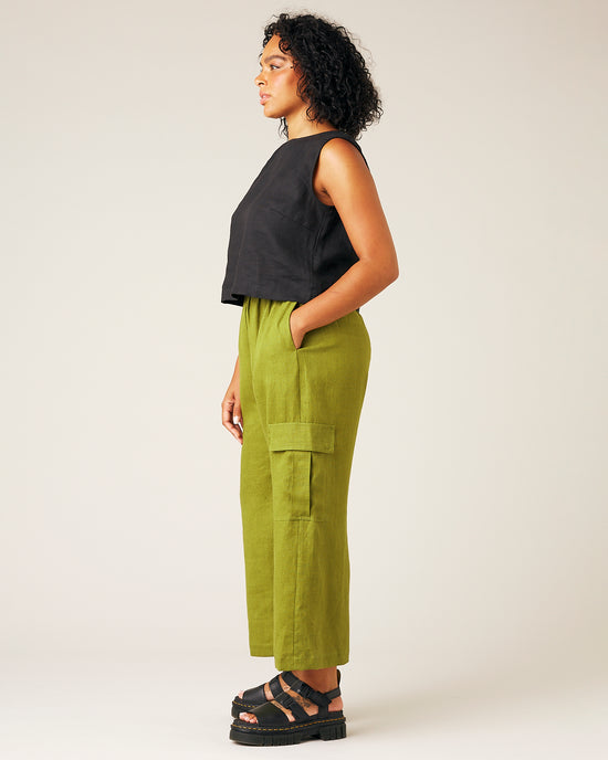 model wears pea pod linen trousers