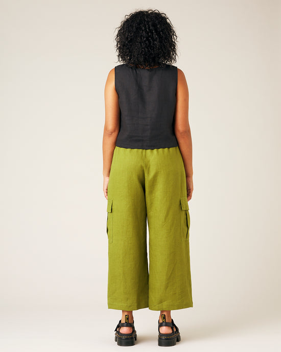 model wears pea pod linen trousers