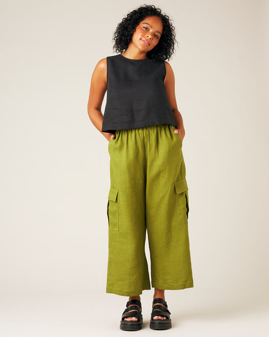 model wears pea pod linen trousers