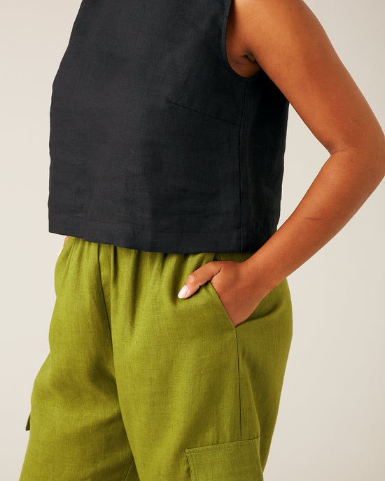 model wears pea pod linen trousers