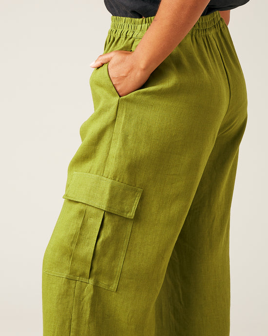 model wears pea pod linen trousers