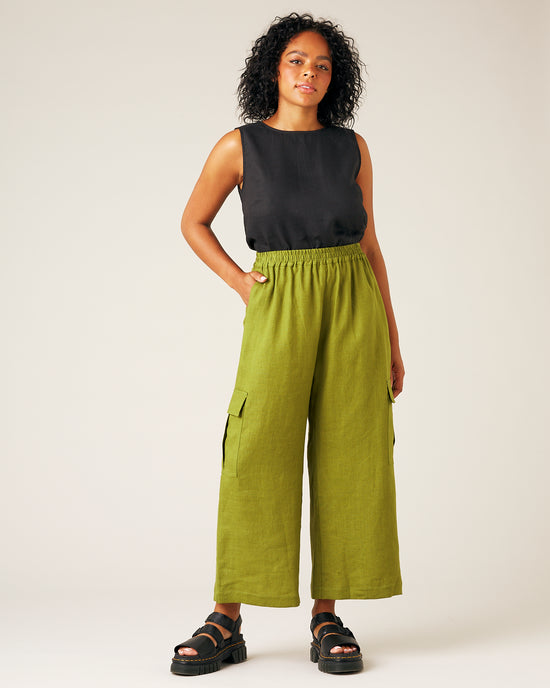 model wears pea pod linen trousers