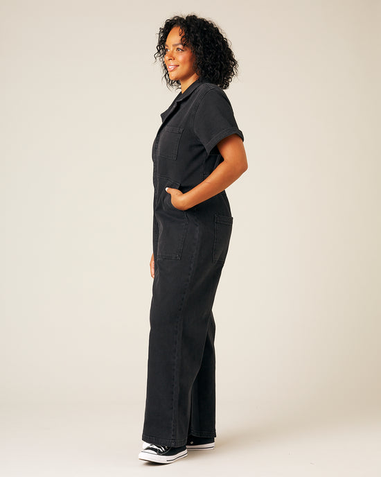 model wear black denim charlie jumpsuit