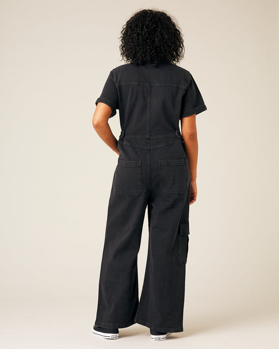 model wear black denim charlie jumpsuit