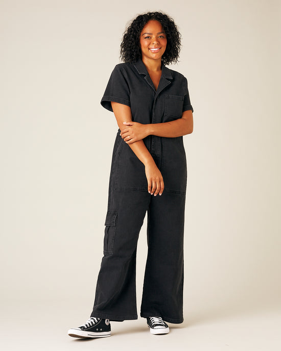 model wear black denim charlie jumpsuit