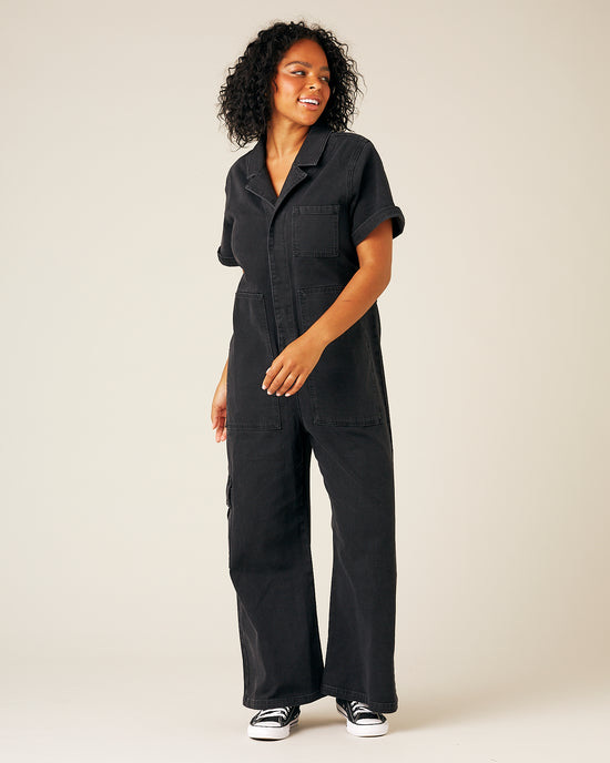 model wear black denim charlie jumpsuit