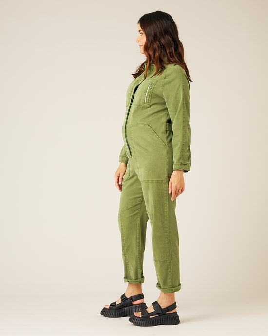 pregnant model wears moss green hallie jumpsuit