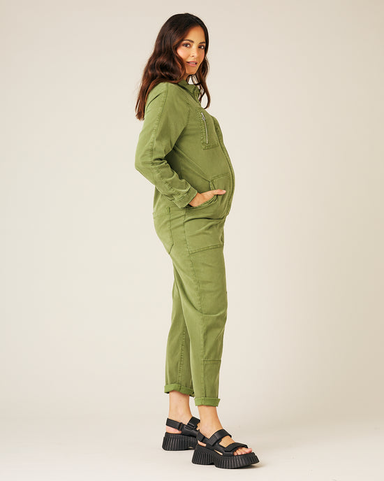 pregnant model wears moss green hallie jumpsuit