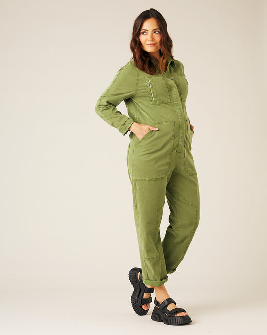 pregnant model wears moss green hallie jumpsuit