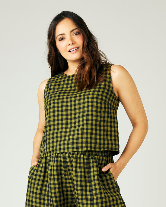 pregnant model wears green gingham linen esme top