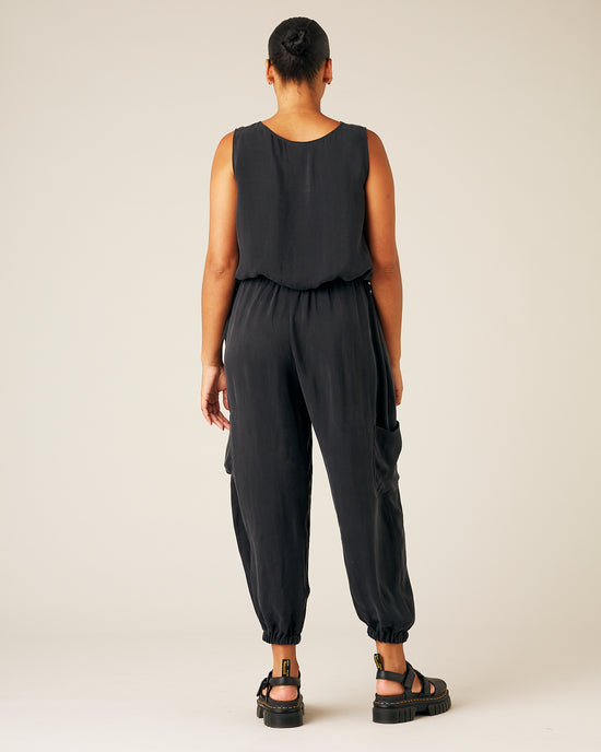 model wears black cupro yoli trousers