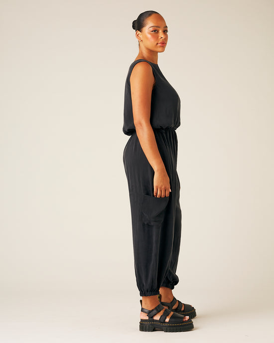 model wears black cupro yoli trousers