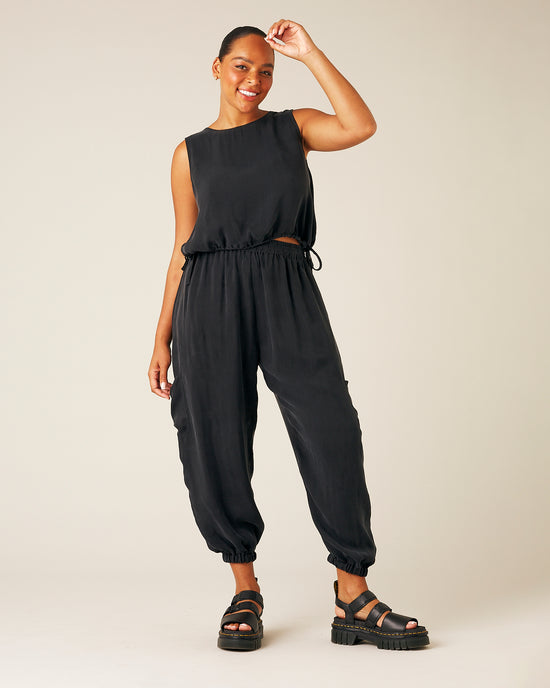 model wears black cupro yoli trousers