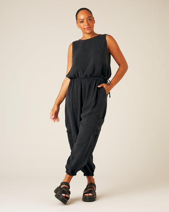 model wears black cupro yoli trousers