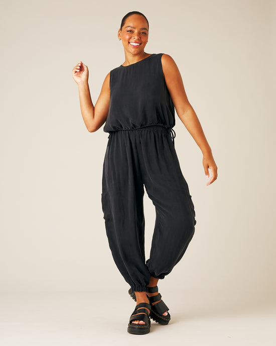 model wears black cupro yoli trousers