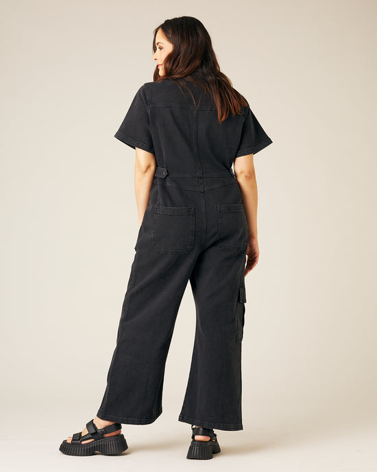 pregnant model wear black denim charlie jumpsuit