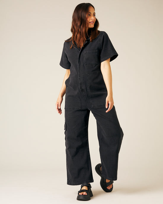 pregnant model wear black denim charlie jumpsuit