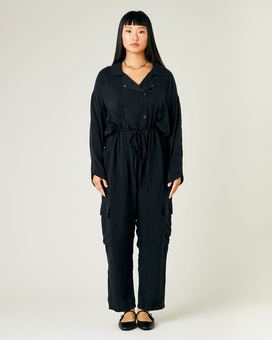 model wears black cupro mila coverall