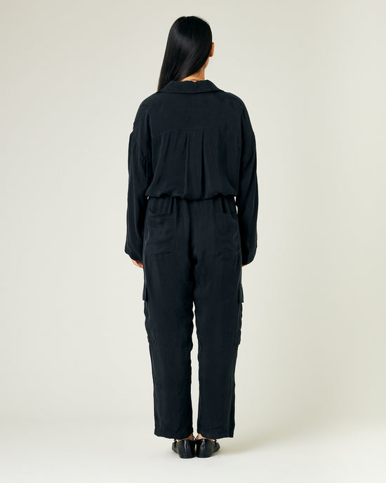 model wears black cupro mila coverall