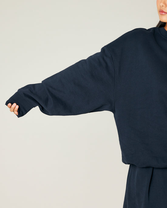 model wears navy jersey riley jumper