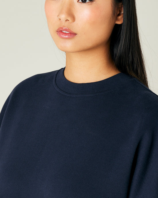 model wears navy jersey riley jumper