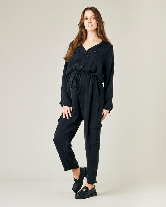 pregnant model wears black cupro mila coverall