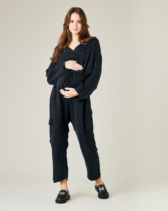 pregnant model wears black cupro mila coverall