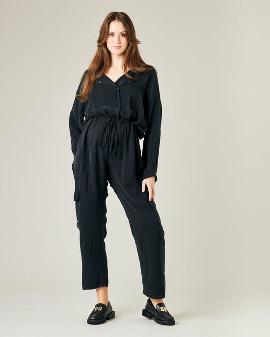 pregnant model wears black cupro mila coverall