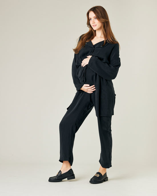 pregnant model wears black cupro mila coverall