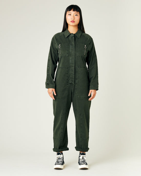 model wears sea green hallie coverall