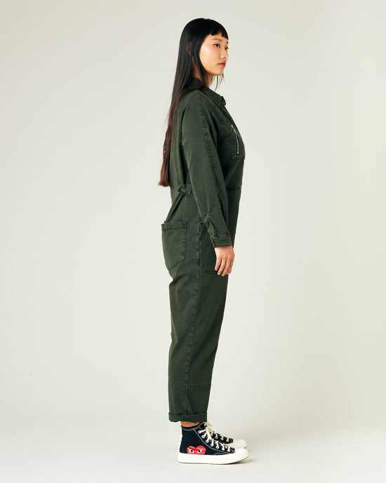 model wears sea green hallie coverall