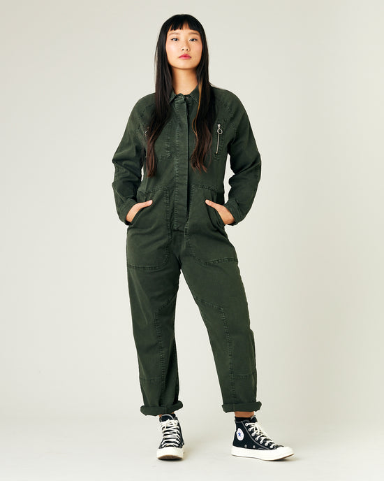 model wears sea green hallie coverall