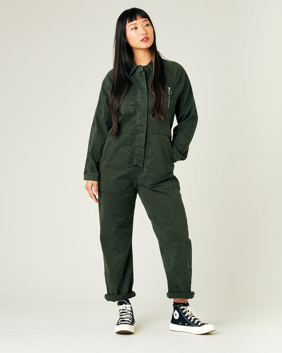 model wears sea green hallie coverall