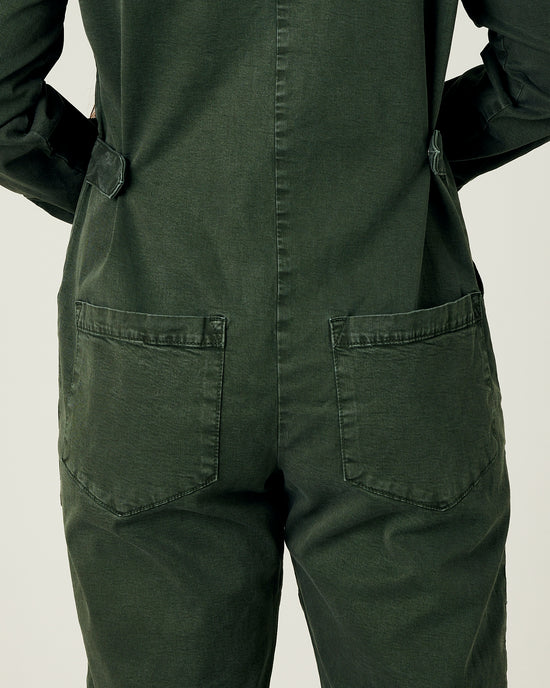 model wears sea green hallie coverall