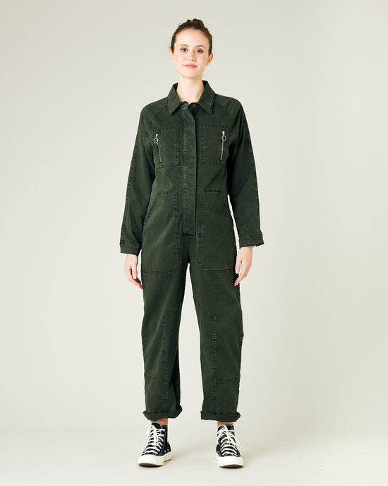 model wears sea green hallie coverall