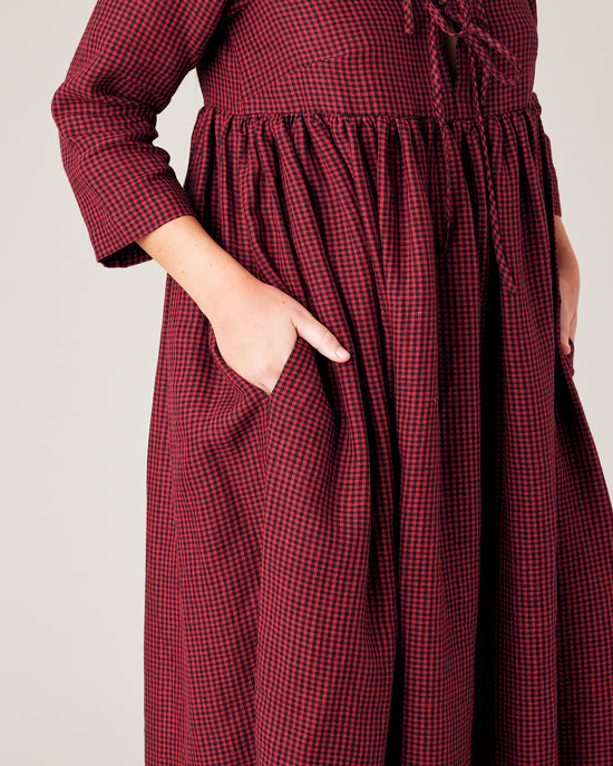 model wears red and black gingham linen willow dress