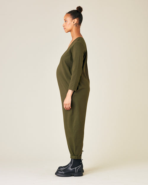 pregnant model wears olive jersey milly jumpsuit