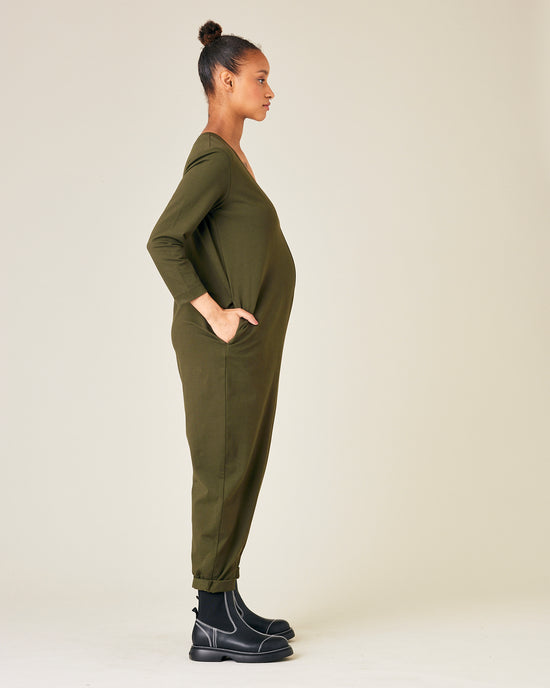 pregnant model wears olive jersey milly jumpsuit