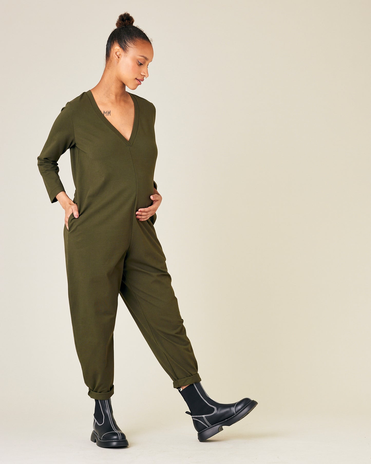 pregnant model wears olive jersey milly jumpsuit