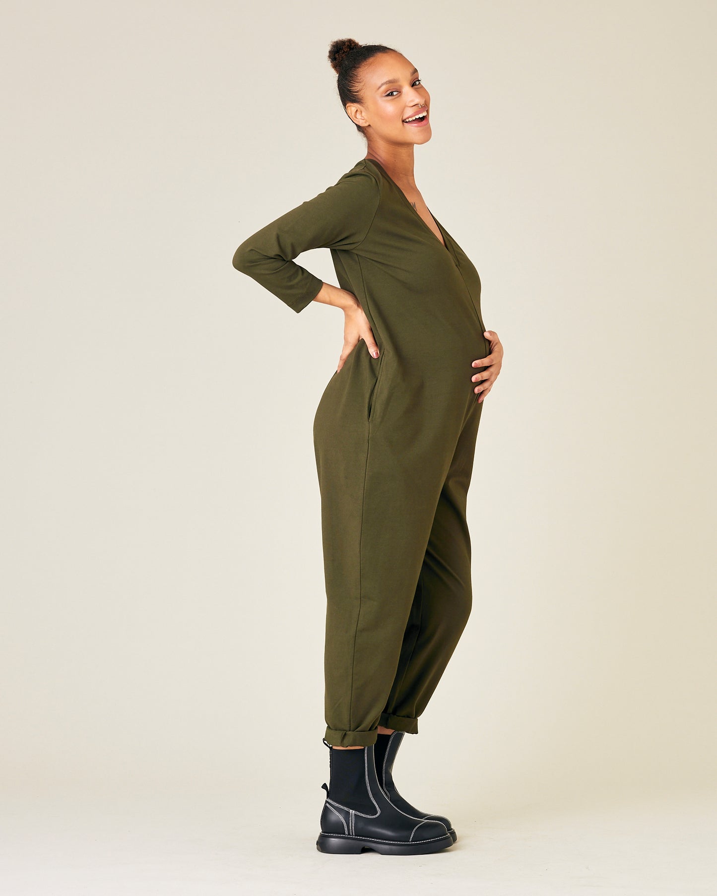 pregnant model wears olive jersey milly jumpsuit