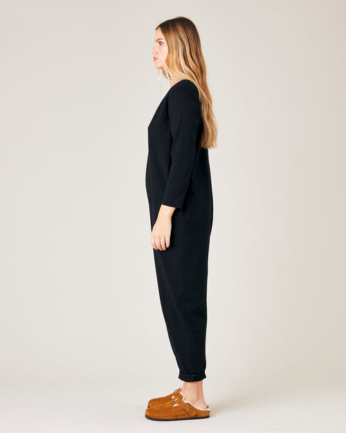 model wears black jersey milly jumpsuit