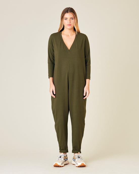 model wears olive jersey milly jumpsuit