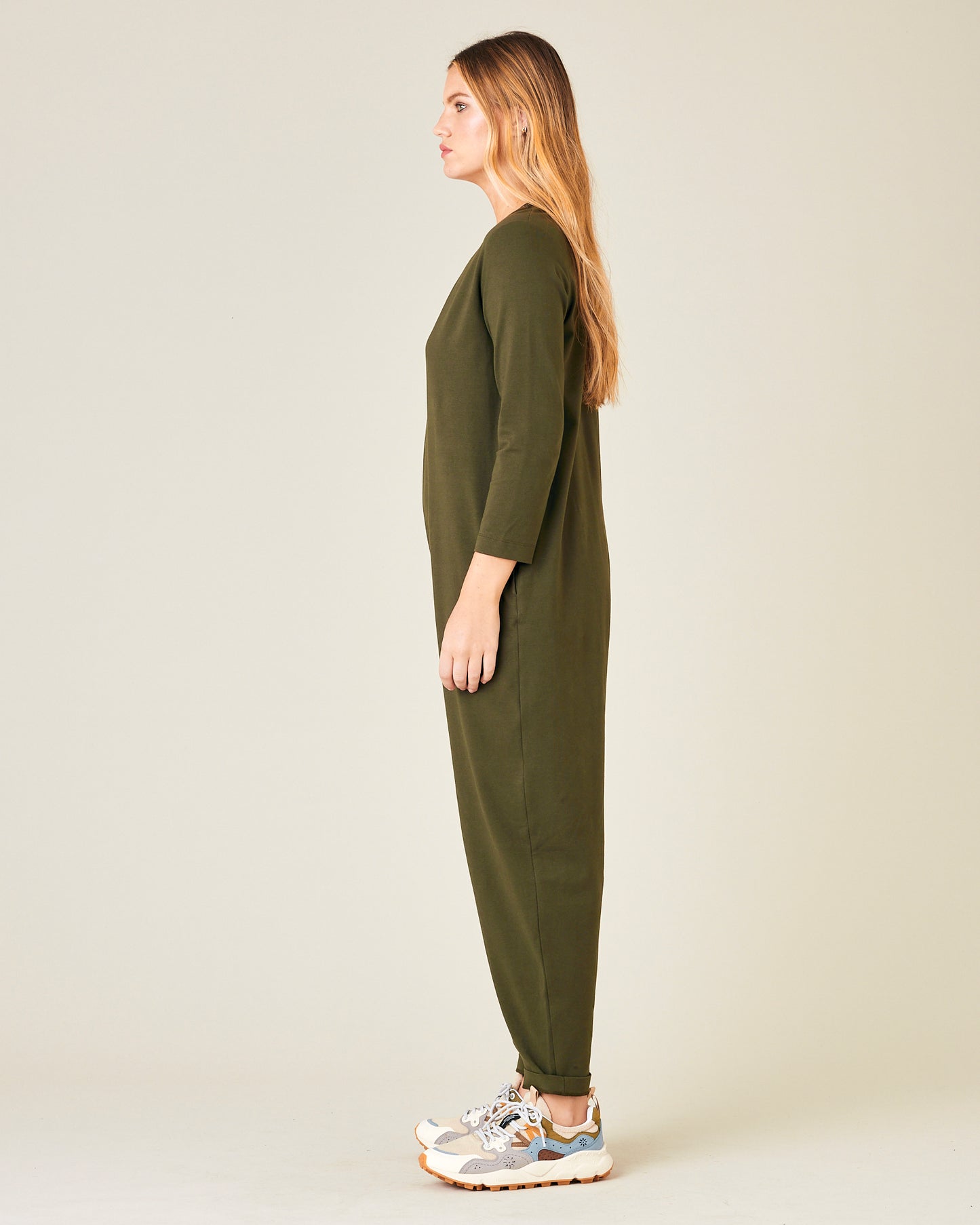 model wears olive jersey milly jumpsuit