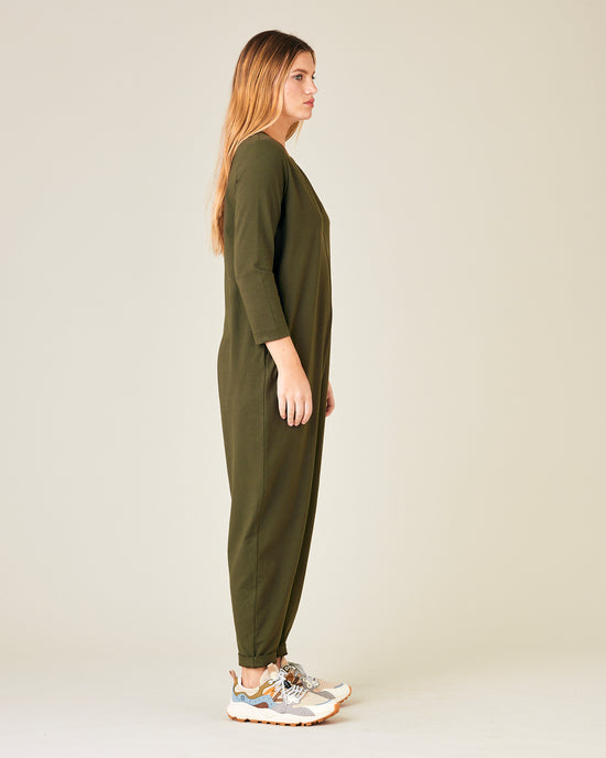 model wears olive jersey milly jumpsuit