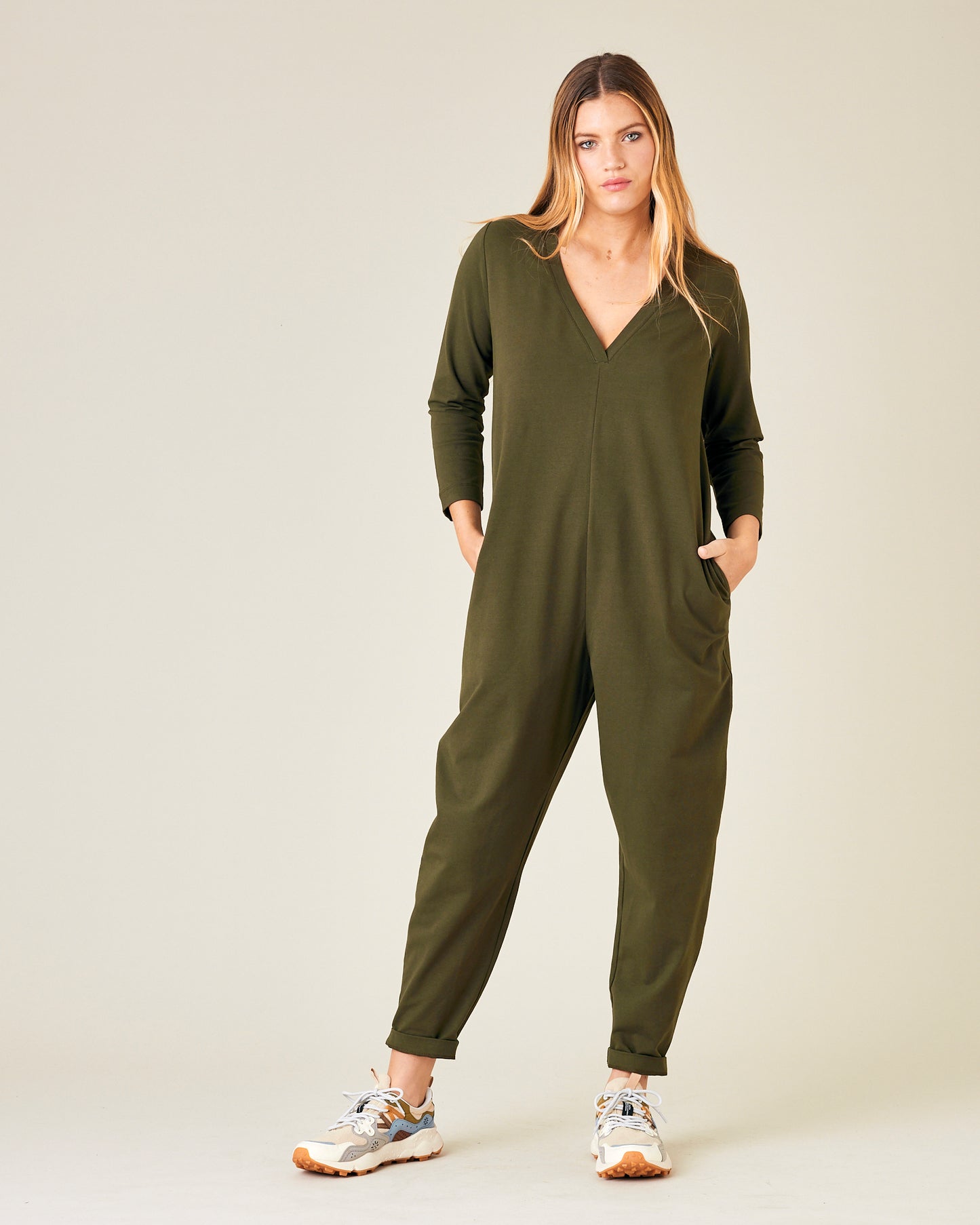 model wears olive jersey milly jumpsuit