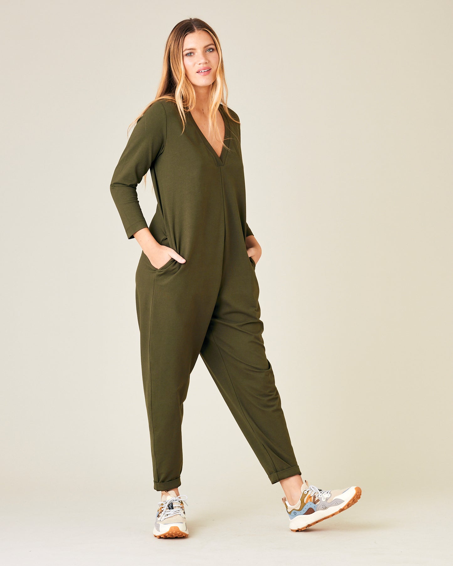 model wears olive jersey milly jumpsuit