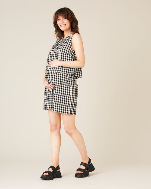 pregnant model wears black and white gingham linen esme top