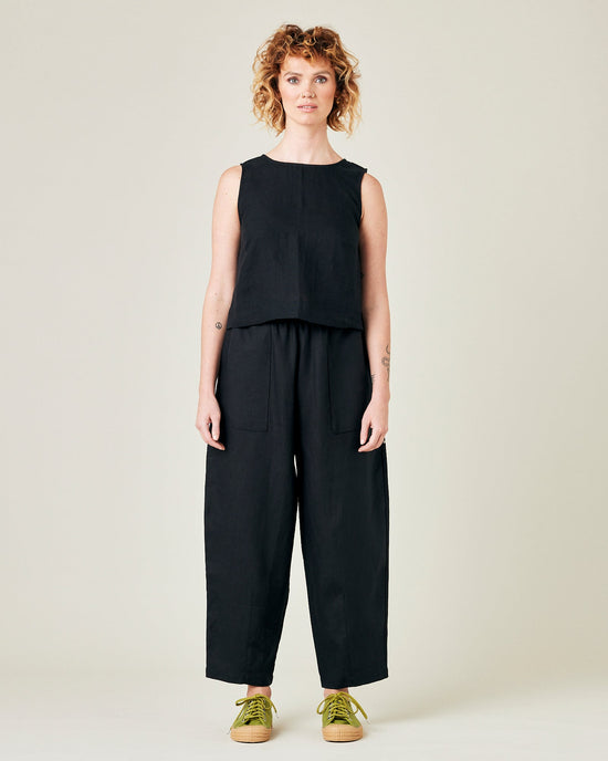 model wears black linen huxley trousers