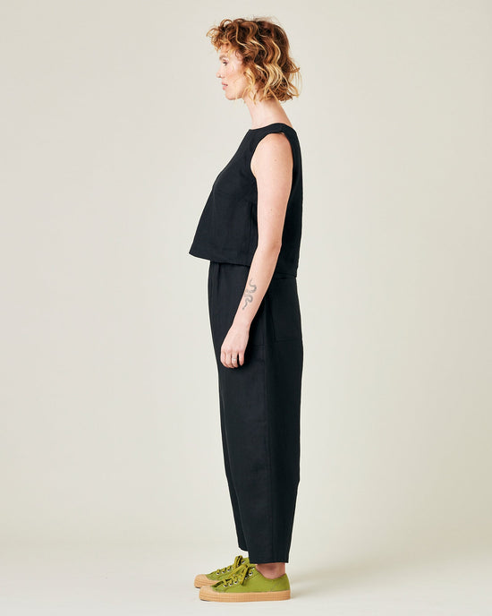 model wears black linen huxley trousers