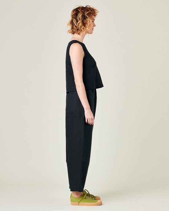 model wears black linen huxley trousers